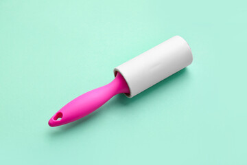 Lint roller on color background