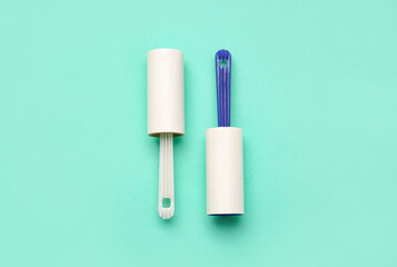 Lint rollers on color background