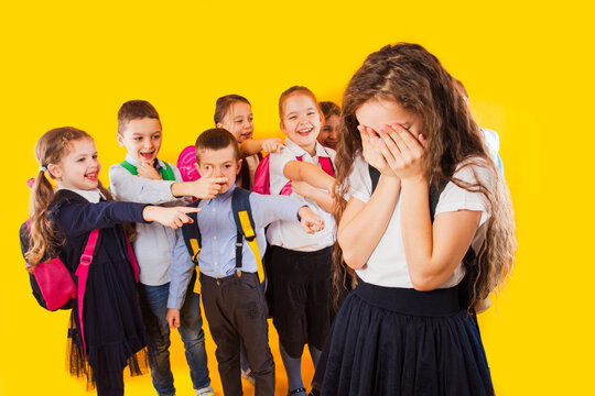School girl being bullied by classmates. School bullying concept