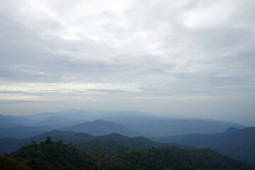 Natural landscape of green mountain range with cloudy blue sky