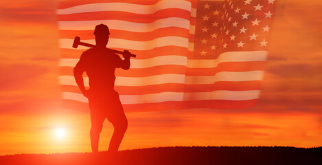 Fototapeta na wymiar Worker on the USA flag background . Labor day holiday concept.
