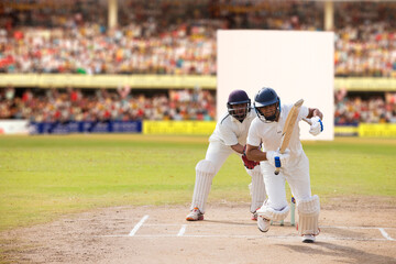 Batsman taking a run during a match