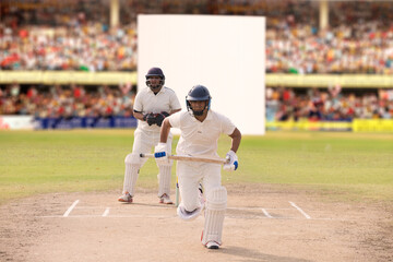 Batsman taking a run during a match