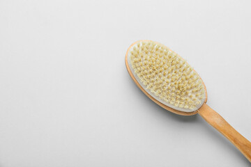 Massage brush on grey background