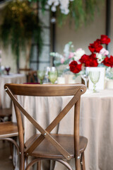 Fototapeta na wymiar Boho wedding chair with decor for guests.