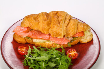 Croissant with salmon for breakfast