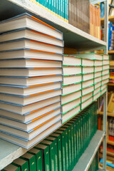 Books on a shelf in the library. Selective focus