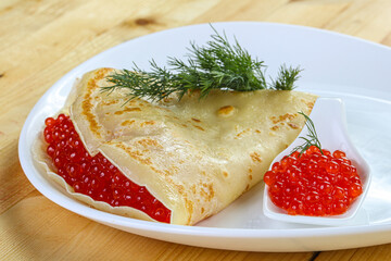 Russian pancake with red caviar