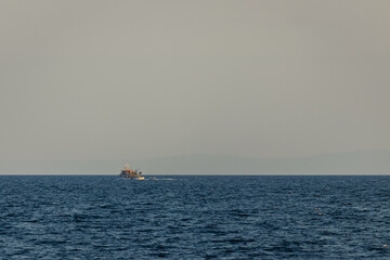 Boat in the sea during dusk