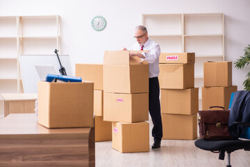 Old businessman employee in relocation concept