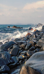 Sea waves crashing on beautiful rocks.