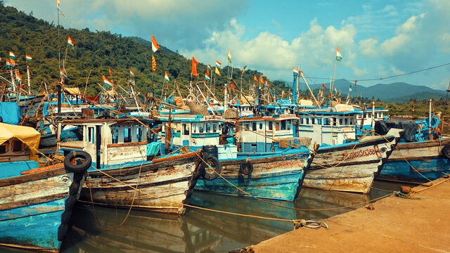 Fishing boats anchored at Amdalli port near Karwar in Karnataka