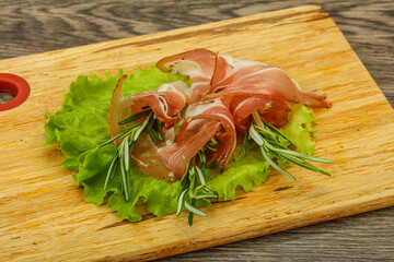 Sliced pork Jamon with rosemary