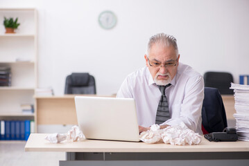 Old male employee in brainstorming concept