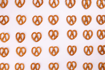 Pretzel cracker laid in rows design on what background