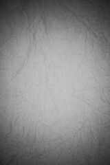 Fototapeta premium Crumpled black paper background.