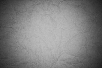 Crumpled black paper background.