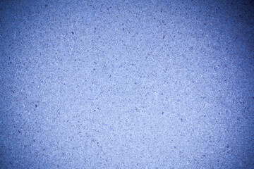 Texture blue recycled compressed wood chippings board background.