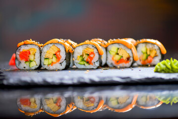 Maki Futomaki Sushi Rolls with eel, egg, unagi sauce. Sushi menu. Japanese food.
