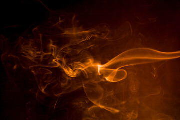 Gold smoke on black background.