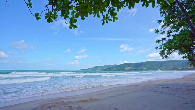 Summer sandy beach Amazing sea clear blue sky and white clouds Wave crashing on sandy shore empty beach at Phuket Thailand, Empty beach sunny day Concept Travel and season tour website background