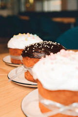 Easter orthodox sweet bread, kulich white vanilla frosting and chocolate frosting. Holidays breakfast