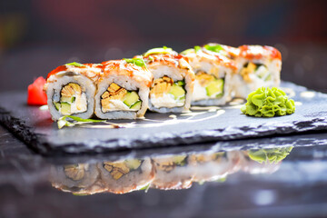 Maki Futomaki Sushi Rolls with eel, egg, unagi sauce. Sushi menu. Japanese food.