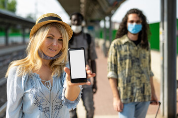 Caucasian adult woman showing health pass from smartphone app, traveler restrictions in time of Covid 19 outbreak, European green pass attesting to vaccination and immunization, mock up