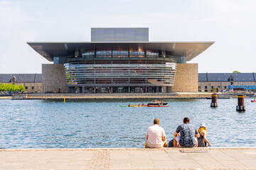 Tourists enjoying the view of the Royal opera house in Copenhagen, Denmark