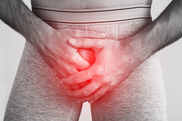 Young man suffering from penile pain
