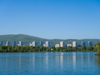 Fototapeta na wymiar The Yenisei River. View of the city of Krasnoyarsk. Summer sunny day. Clear sky