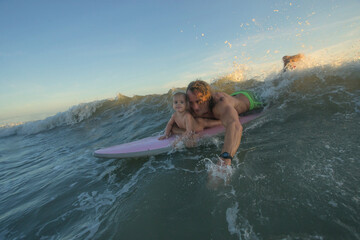 Father and Daughter Surfing Together, Summer Lifestyle Family Concept