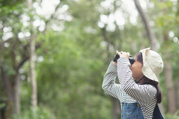 Happy kid looking ahead. Smiling child with the binoculars. Travel and adventure concept. Freedom, vacation