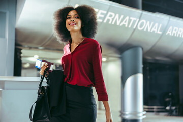 Female business travelers on transit at airport terminal