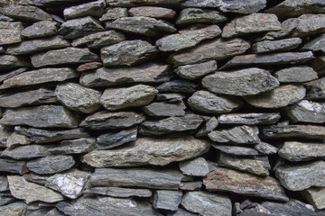 Stone wall background. Wall built of stone