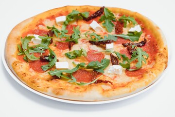 Delicious italian pizza over white background top view