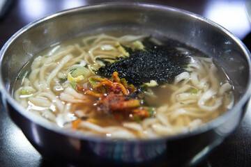 Kalguksu with vegetables and green onion in noodles kneaded with flour and cut with a knife, Korean...