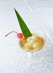 cold sweet dessert platter with pudding, mango, fruits, deep fried red bean paste, jelly, strawberry, watermelon, almond, longan, lychee in white background asian halal menu