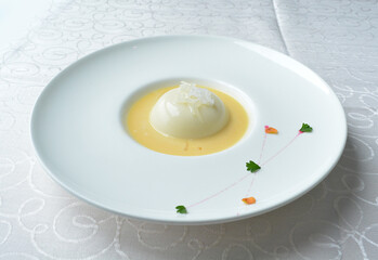 chilled mango pudding with mango puree soup dessert in white background asian halal menu