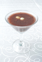 chilled red bean paste soup in cocktail glass in white background asian halal menu
