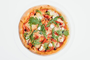 Delicious italian pizza over white background top view