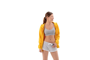 yellow hoodie on a young woman wearing in shorts and top isolated on white background