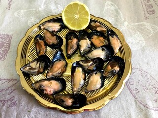 Delicious raw mussels on a plate