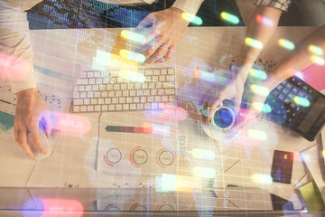 Double exposure of man and woman working together and data theme hologram drawing. Computer background. Top View.