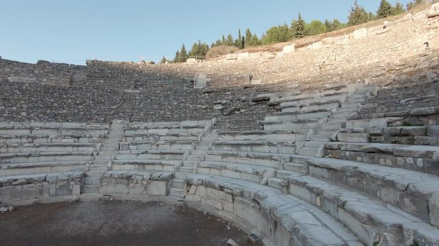 Left side panning shot of The Bouleuterion, Odeon ancient semi circular theatre in Ephesus Turkey.