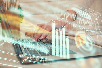 Double exposure of woman hands typing on computer and technology theme drawing. High Tech concept.