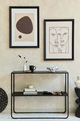 Creative composition of stylish modern living room interior with two mock up poster frames, black geometric commode, coffee table and personal accessories. Neutral colors. Template.