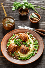 english meatballs, faggots with potatoes and peas