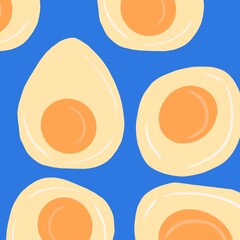 Scrambled eggs pattern.  Breakfast on a blue background.  Fried eggs morning meal