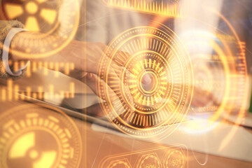 Double exposure of tech theme hologram and man and woman working together holding and using a mobile device.